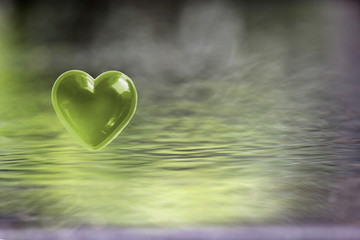Green Heart with soft focus water reflections