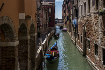 medieval architecture, houses, bridges, squares and boats on the canal-streets of Venice, Italy