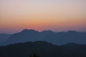 silhouetted mountains.