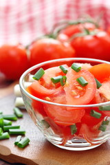 Fresh salad with tomatoes and spring onion