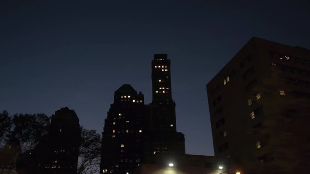 CLOSE UP: Residential blocks of flats and office buildings in NYC at night
