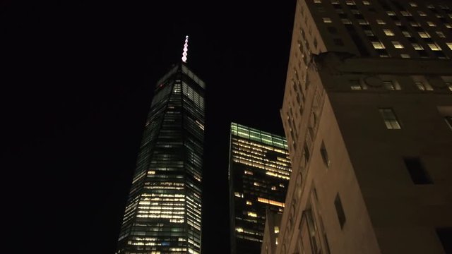 LOW ANGLE VIEW: Driving Past Lit One World Trade Center Skyscraper At Night