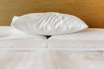 Fototapeta na wymiar White pillows on the bed