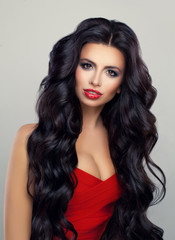 Fototapeta premium Glamorous Woman with Long Curly Hair