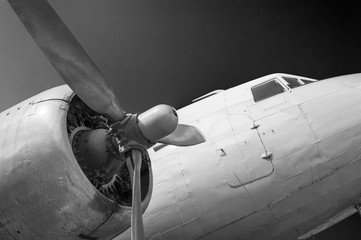Close up on old airplane (biplane) with enormous propeller engine