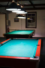 In the billiard room, two empty table