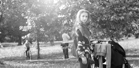 walk women with stroller summer sunlight