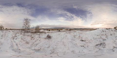 Full 360 degree equirectangula panorama snow-covered hills in the city