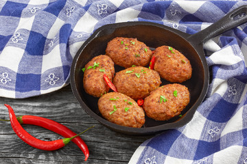 juicy delicious meat cutlets  sprinkled with chili pieces