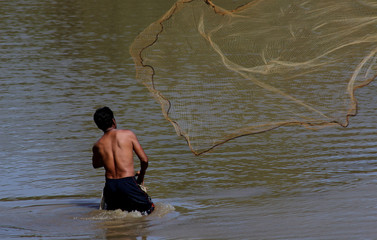 Men are using nets to catch fish