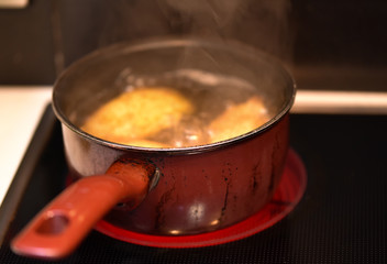 potatoes boiling in casserole