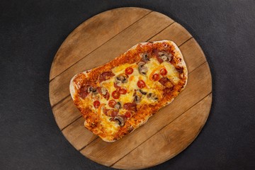 Delicious italian pizza served on wooden board
