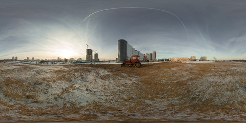 Full 360 degree equirectangula panorama on the frozen river in the city