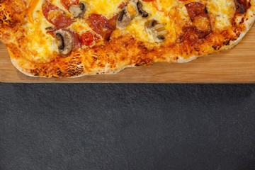 Delicious italian pizza served on wooden board