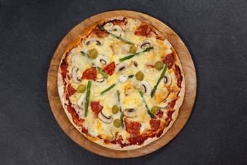 Delicious italian pizza served on wooden board