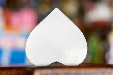White heart shaped on wooden table
