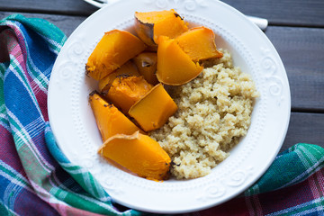 a dish of cooked pumpkin and quinoa