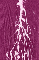 Purple wooden wall with white paint drips, drops and stains
