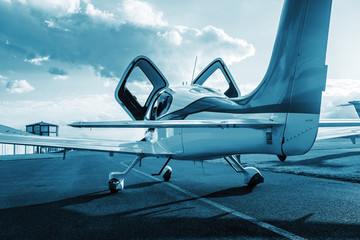 Private single turboprop aircraft parked on runway