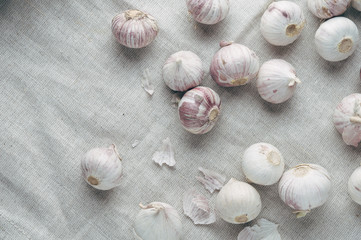 Dried garlic on a light wooden background