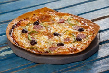 Delicious italian pizza served on pizza tray