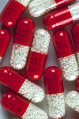Red and White Capsule Pills Close Up