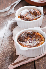 French dessert cherry clafoutis in ceramic ramekins