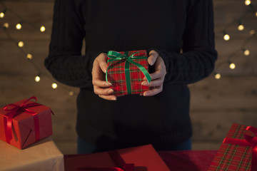 Women are handing Christmas gifts