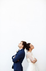 creative bride and her charming man posing for the camera