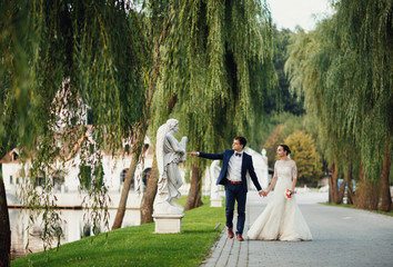 young couple walking beautiful   alley