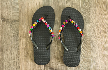 Sandals on wood floor.