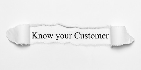 Know your Customer on white torn paper
