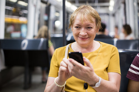 Senior Woman Commuter Waiting Train