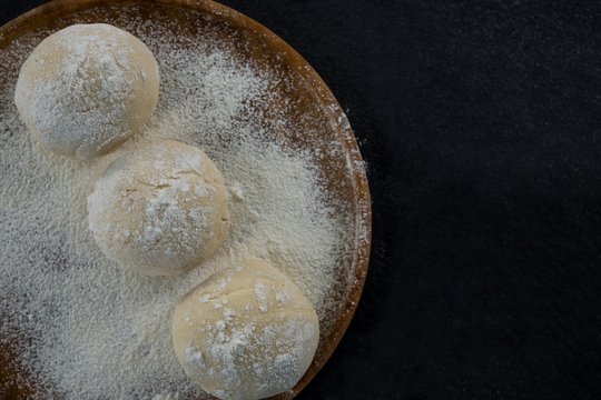 Pizza Dough Ball On A Rolling Board