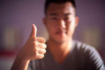 Good or Very good hand sign by asia man.Selective focus