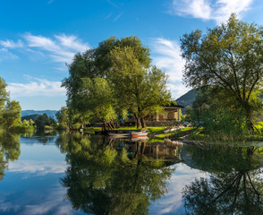 Beautiful river landscape city Dodoshi with reflection of trees