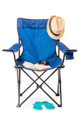 Blue folding chair and set a relaxing holiday, close up isolated