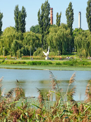 A white monument at the alley on the river Wislok in Rzeszow.
