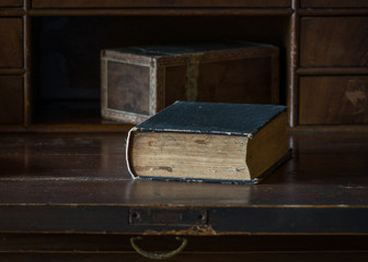 The old and vintage book on a wooden table