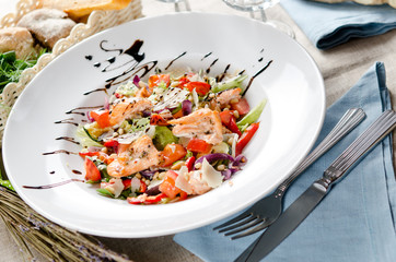 salad with fried salmon, pine nuts and parmesan