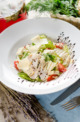 Caesar salad with fried chicken breast