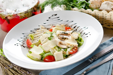 Caesar salad with fried chicken breast