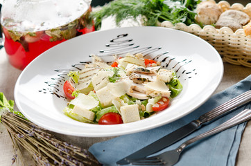 Caesar salad with fried chicken breast