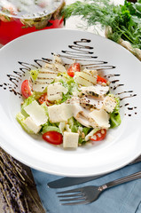 Caesar salad with fried chicken breast