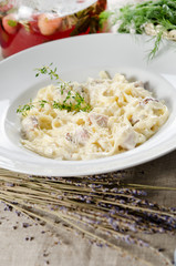 tagliatelle carbonara with bacon, cream sauce and cheese Parmigi