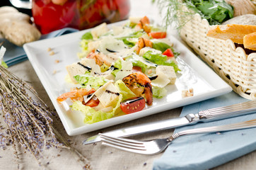 Caesar salad with fried shrimps