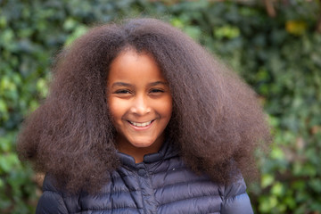 Pretty girl with long afro hair with a blue coat