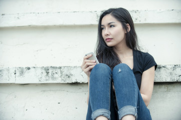 young hipster woman using mobile smart phone