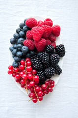 Mix of fresh berries. Raspberry, red currant, blackberries, blub