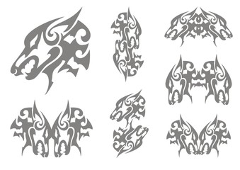 Gray wolf head symbols in tribal style. Double peaked aggressive heads of a wolf on a white background